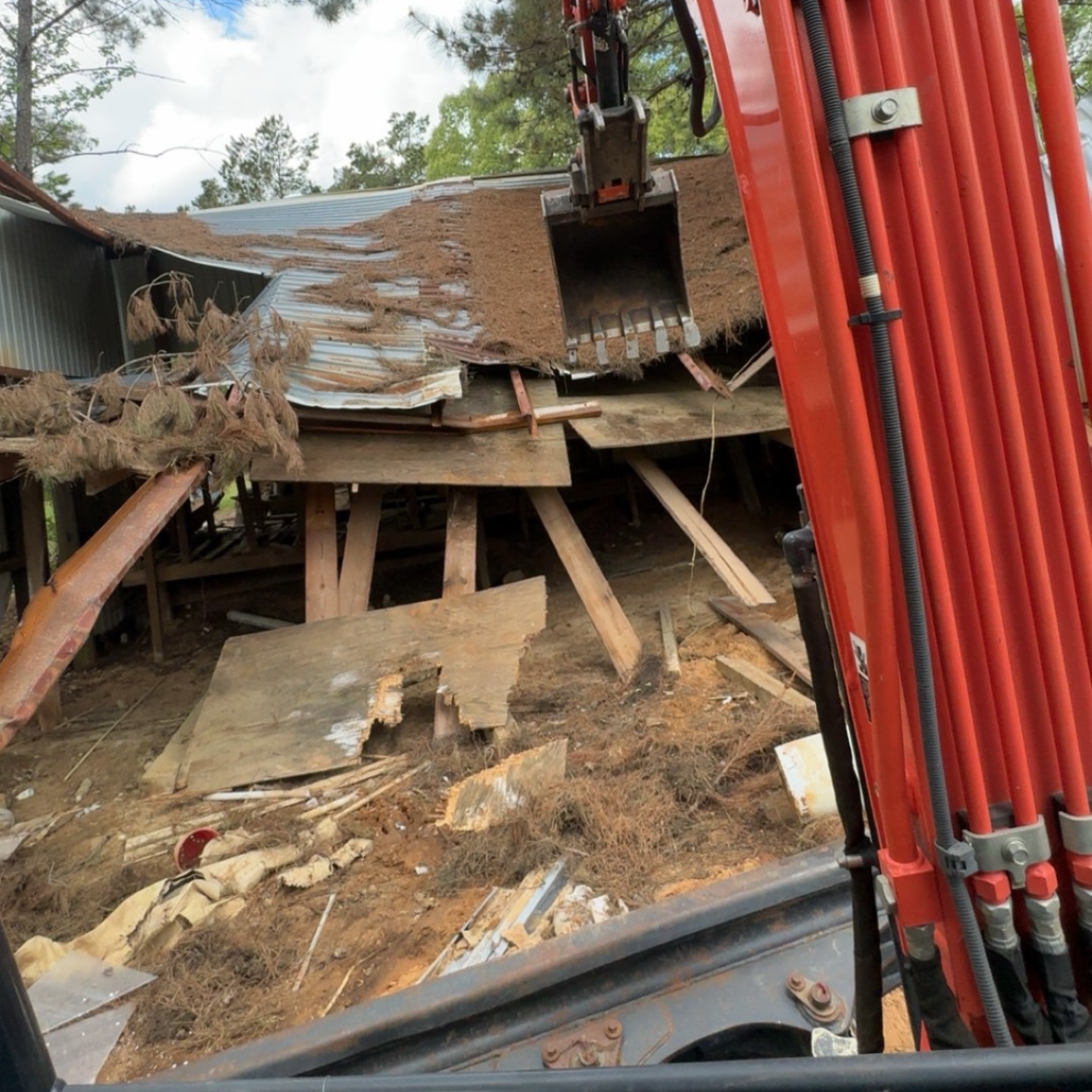 Heavy equipment light structural demolition jobsite